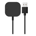 Sort magnetisk oplader med USB-stik til Xplora X6 Play. Viser opladningspad'en med to guldstik og et USB-A-stik for nem tilslutning.